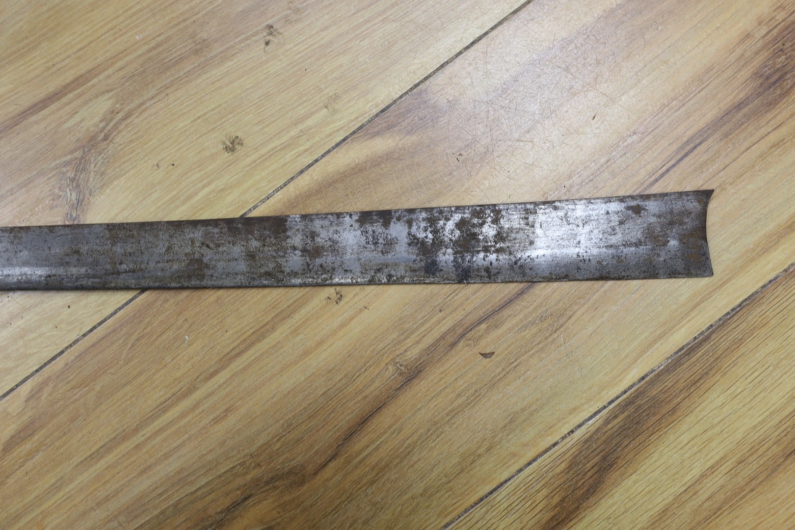 Two Burmese dha swords.